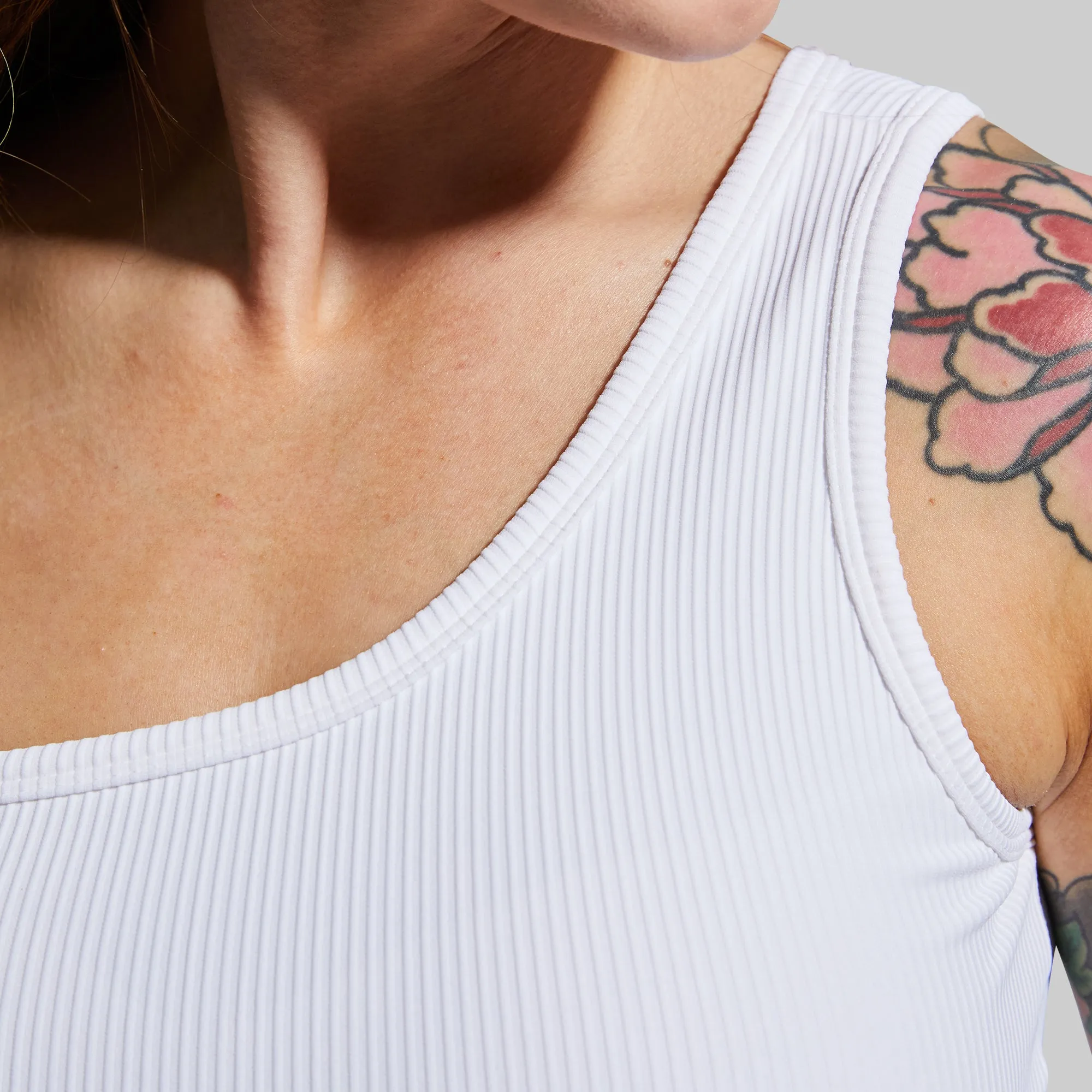 Half-sleeved seams Reinforced stitching seams Evolve Sports Bra (White)