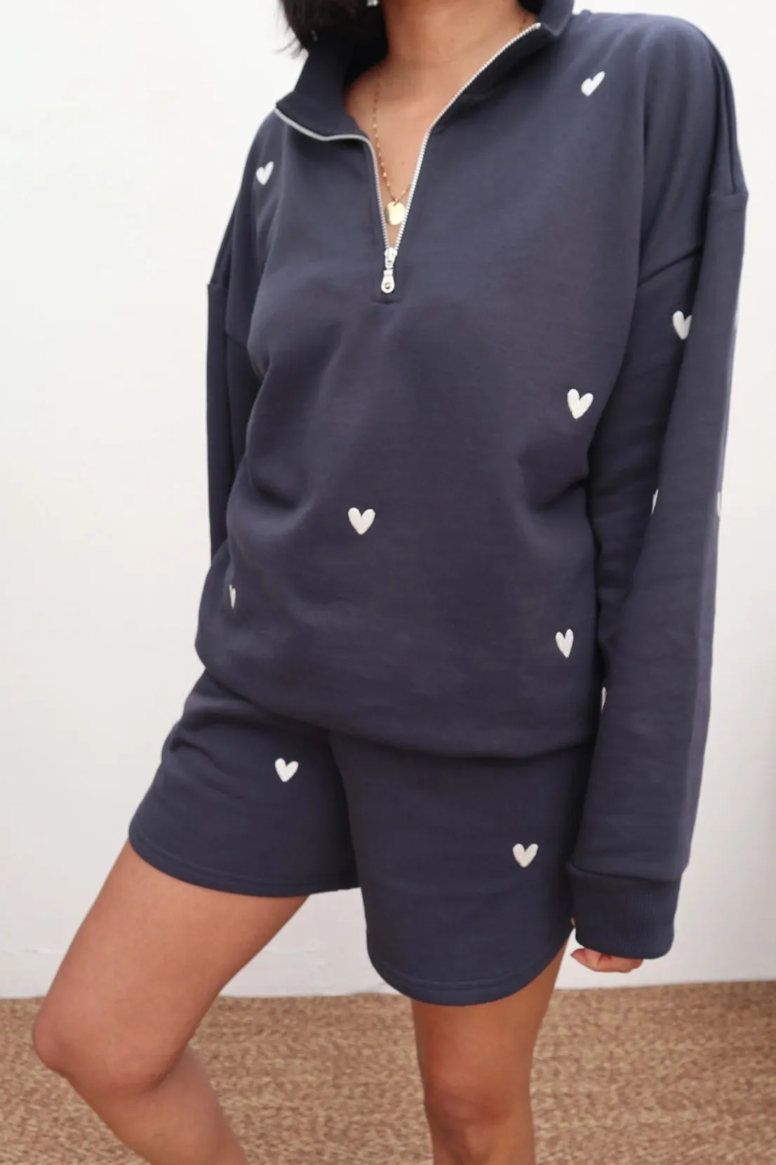 couple wear O&F Navy Heart Embroidered Quarter Zip Sweatshirt