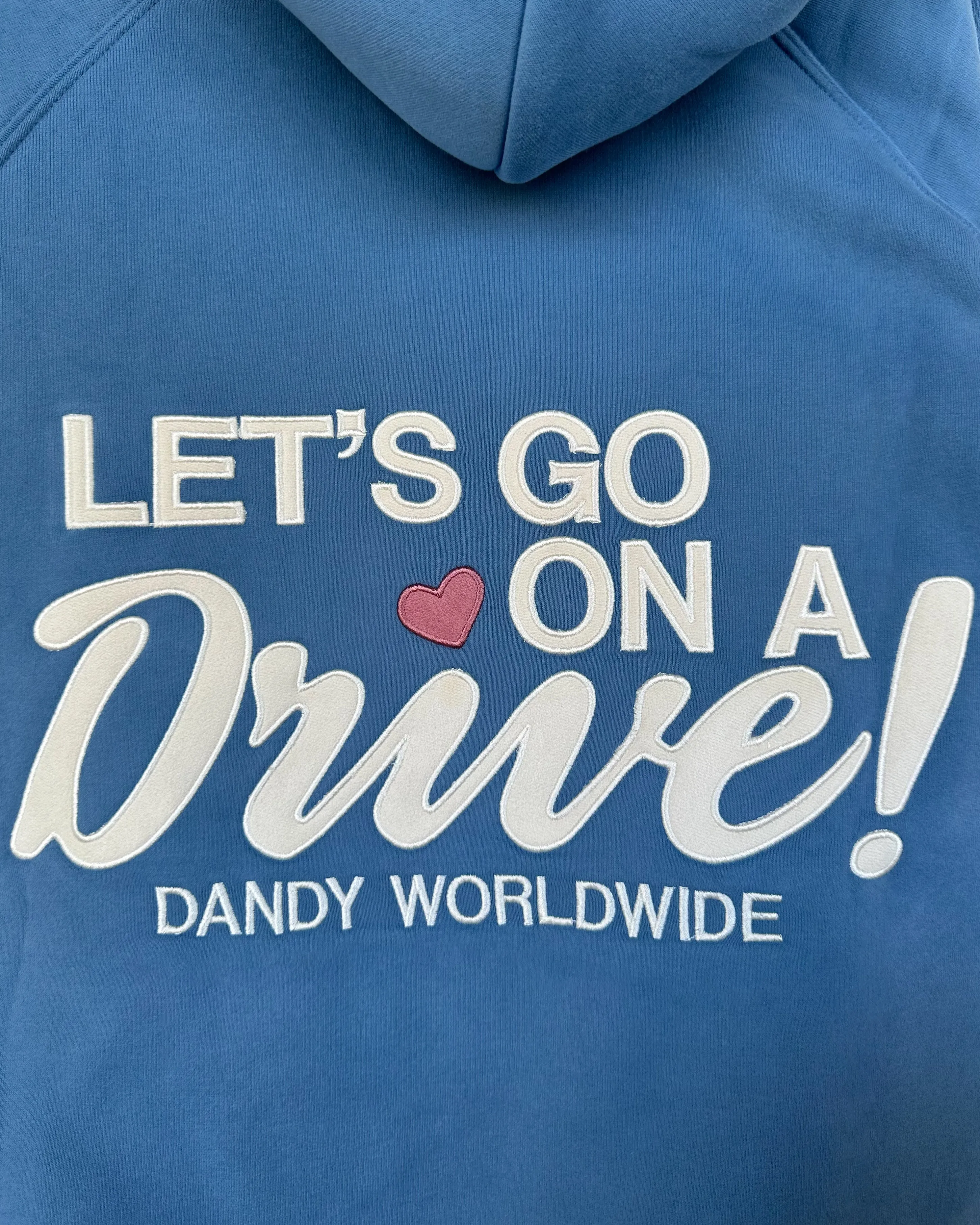 brooch accents Water-Repellent Finish "Let's Go on a Drive" Oversized Lux Hoodie in Blue